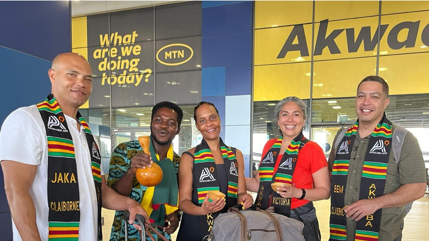 A diaspora family arriving in Ghana, welcomed with personalised Akwaaba kente stoles