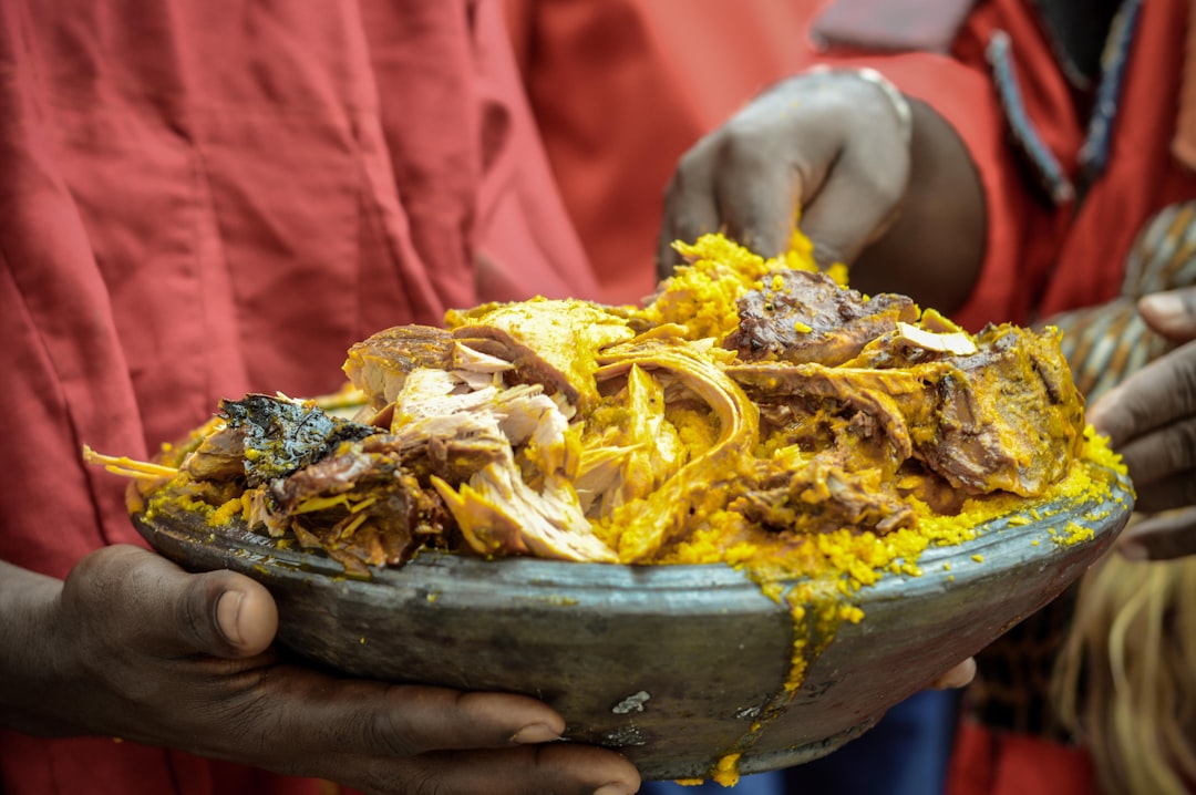Person holding traditional Ghanaian street food dish in Accra