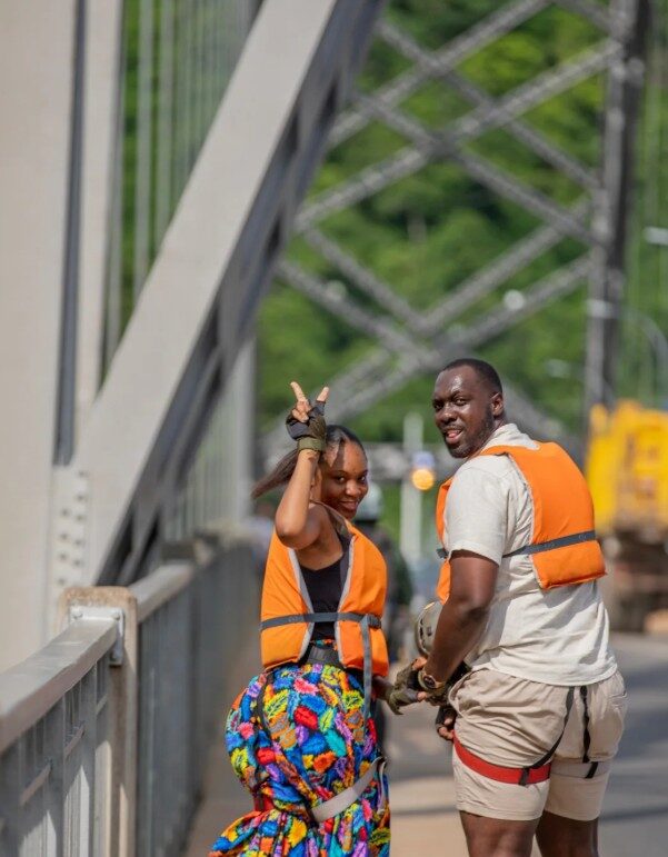 Guests preparing to abseil from the Adomi Bridge over the Volta River