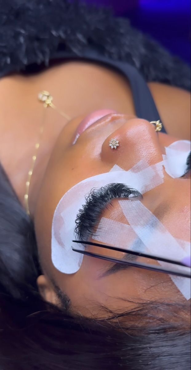A lash application close-up at a glow-up beauty experience in Accra