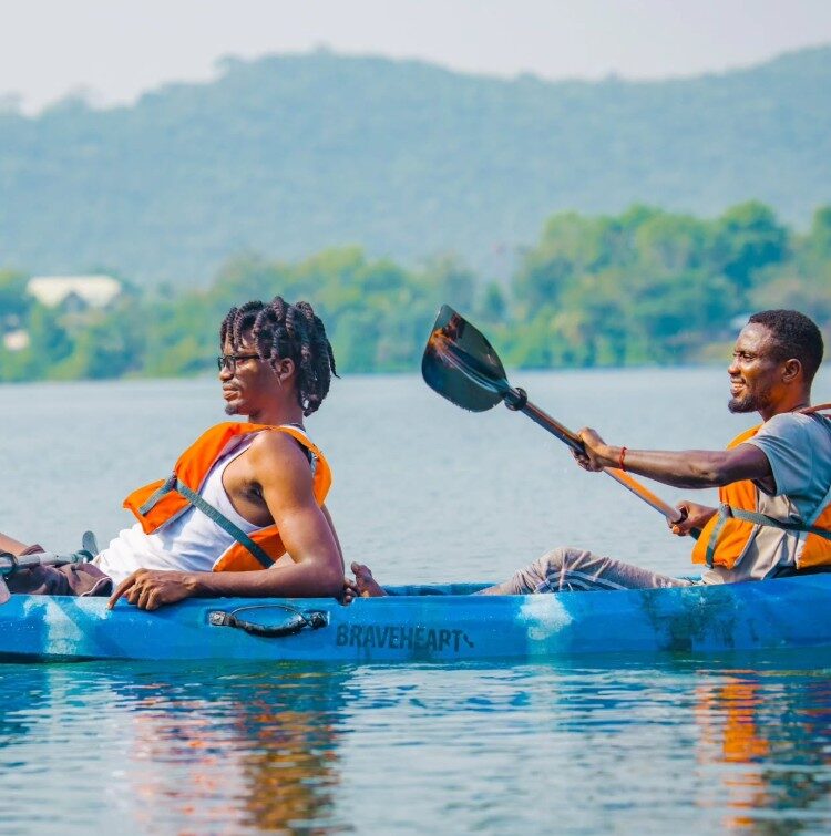 A couple kayaking together on the Volta Lake in Ghana