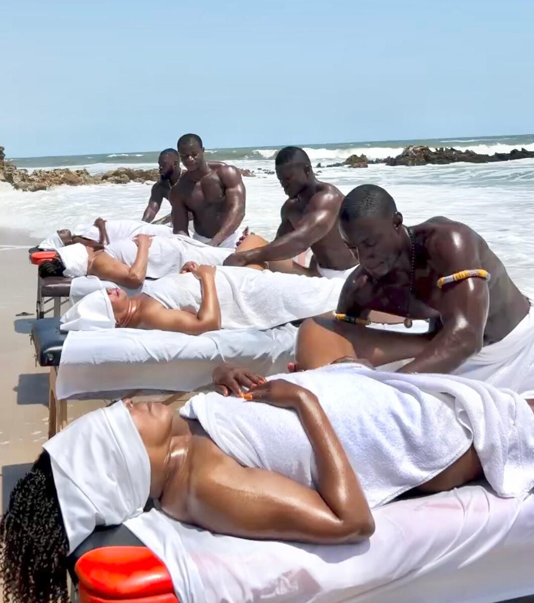 A row of beach massages by the ocean in Ghana